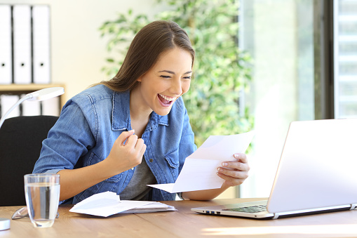 Woman viewing her mail online via USPS Informed Delivery