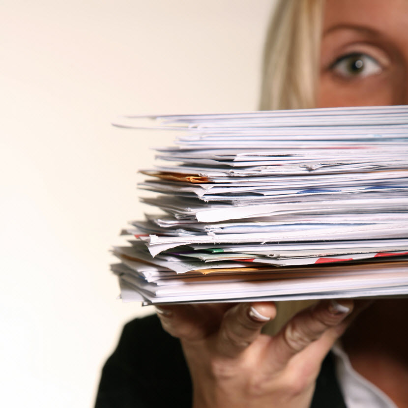 woman holding a pile of mail