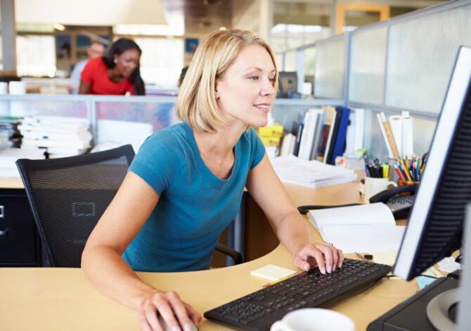 woman typing at a computer